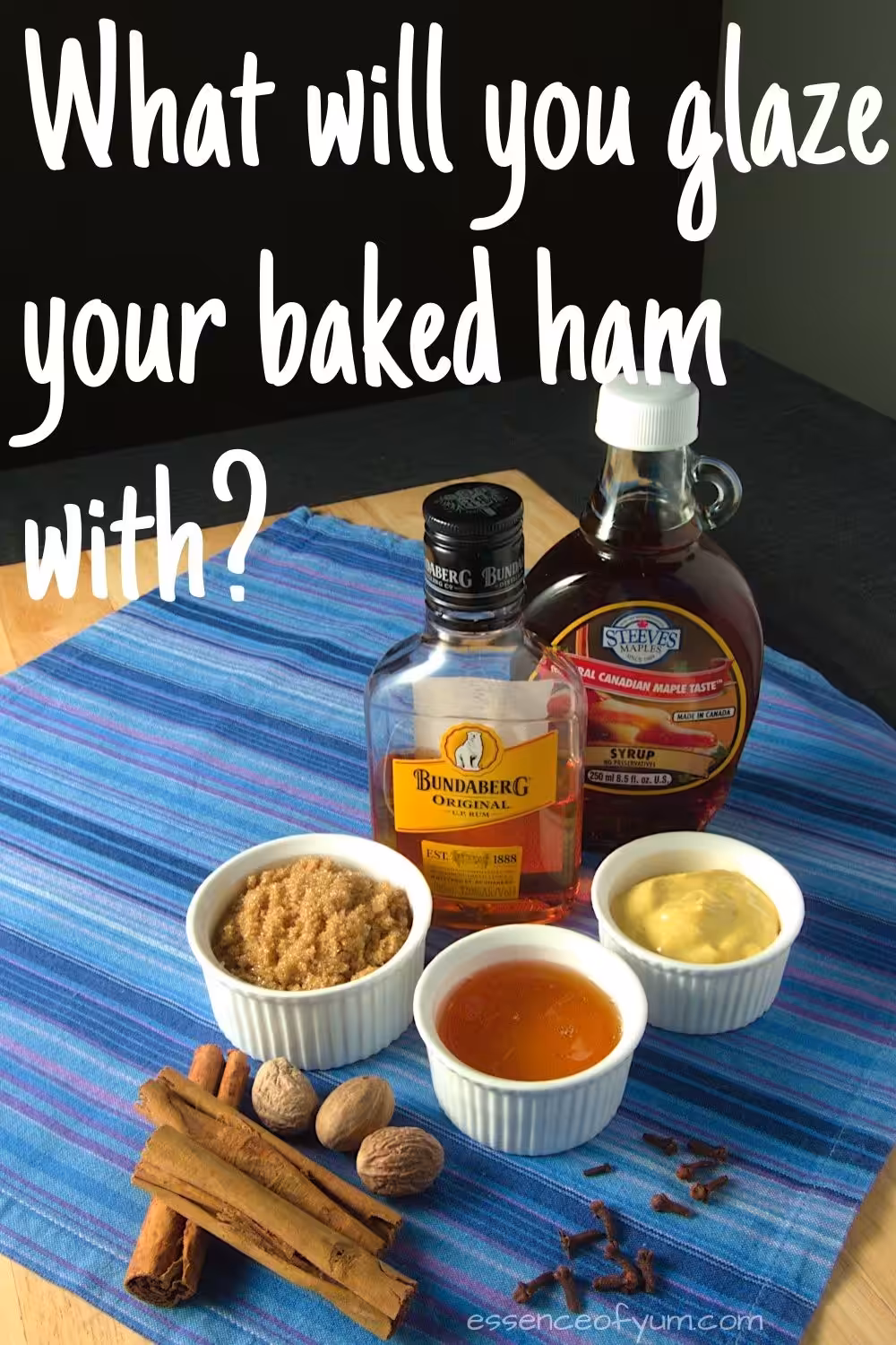 A variety of sauces, spices and other ingredients on a blue cloth with the text what will you glaze your baked ham with.