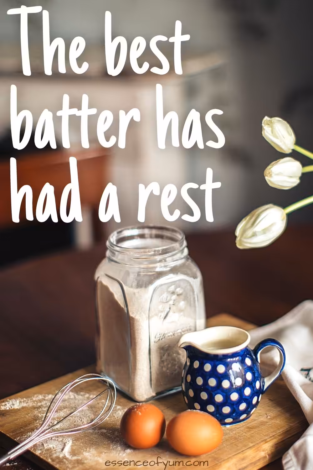 A jar of flour, a small blue jug of milk and two eggs with the words the best batter has had a rest