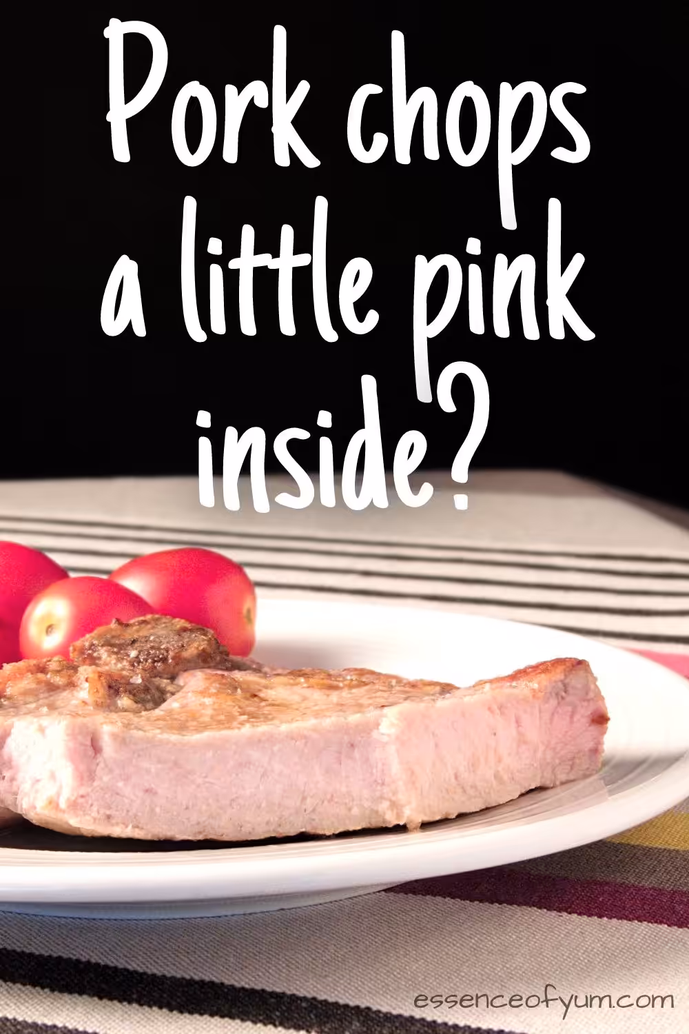 A cut pork chop showing a pale pink colour inside the meat with the question pork chops a little pink inside.